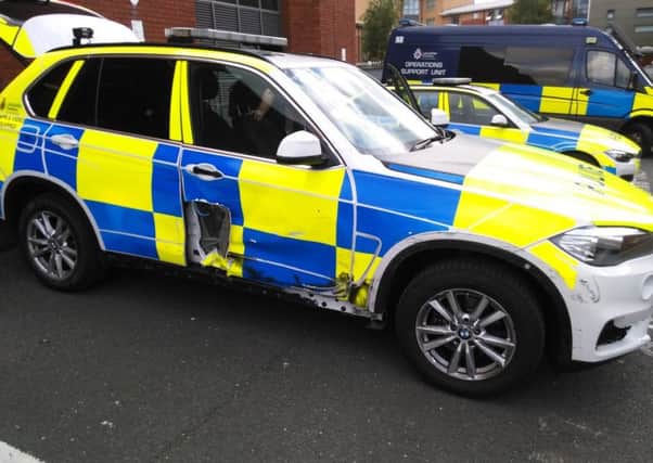 A police car that was rammed in a pursuit from Kirkby to Preston. A motorist was arrested.