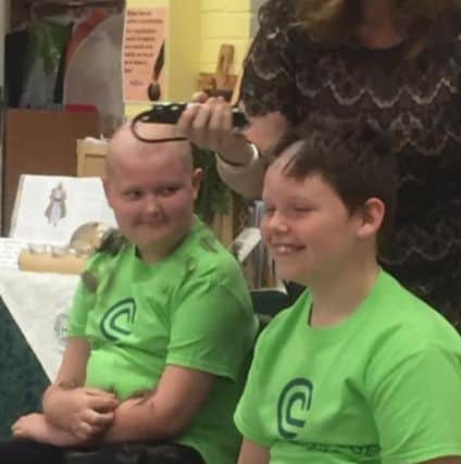 Reece Holt and brother Callum who had a sponsored head shave to raise money for Clatterbridge Cancer Centre