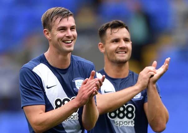 Paul Huntington and Bailey Wright applaud the PNE fans at Bolton