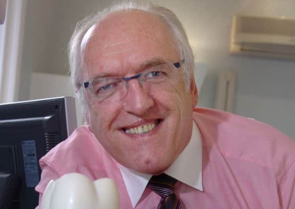 PAYOUT: Dentist Roger Hughlock