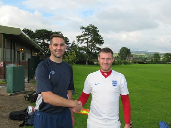 Garstang assistant boss Neil Beesley, left, welcomes new signing Chris Byrne to the club