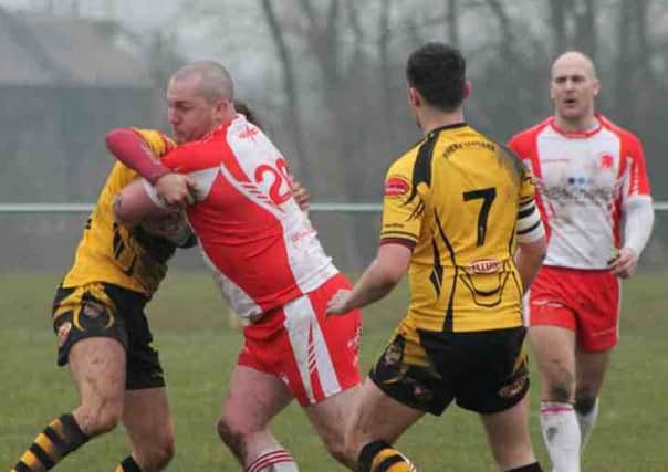 Si Dempsey carries the ball against Leigh Miners Rangers