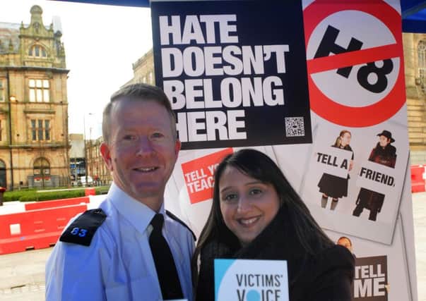 RISIGN FIGURES: Hate crime officer PC Stuart Rutlidge and police link worker Farhet Quraishi at an anti-racism event in Preston earlier in the year
