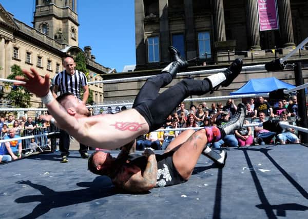 Preston City Wrestling Club held a free event at Preston Flag Market to celebrate its fifth anniversary. Alex Boylin goes flying with T Bone.