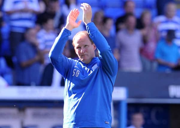 Preston North End manager Simon Grayson applauds the travelling fans.