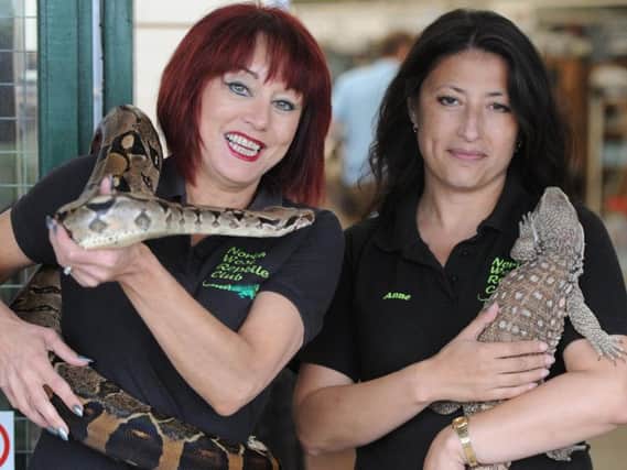 Amanda McBride and Anne Nadin of the North West Reptile Club with Buffy a boa and a Bosc Monitor