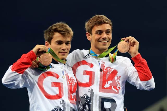 Great Britains Daniel Goodfellow and Tom Daley celebrate with their bronze medals  but is there too much sport on the TV?