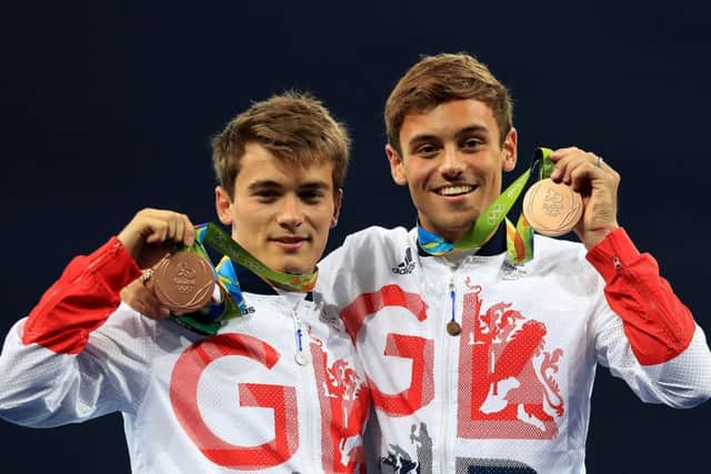 Great Britains Daniel Goodfellow and Tom Daley celebrate with their bronze medals  but is there too much sport on the TV?