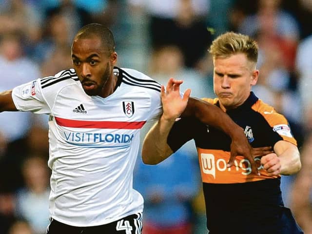 Fulhams Dennis Odoi (left) and Newcastles Matt Ritchie battle at Craven Cottage