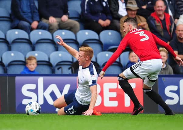 Eoin Doyle is fouled by Fulham's Scott Malone