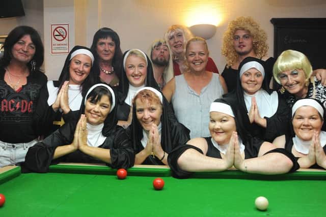 Members of Bamber Bridge Trades Hall pool teams held a 'tarts and vicars' fancy dress pool night to raise funds for Derian House.
The teams with Derian House Community Fundraiser Judy Miller (grey top).  PIC BY ROB LOCK
16-8-2016