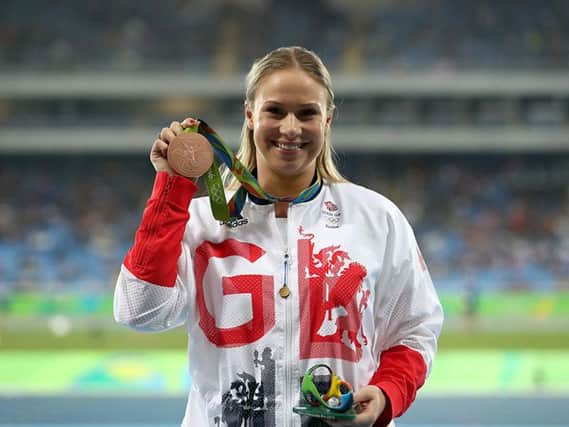 Great Britain's Sophie Hitchon is presented with the Bronze medal for the Women's Hammer Throw at the Olympic Stadium