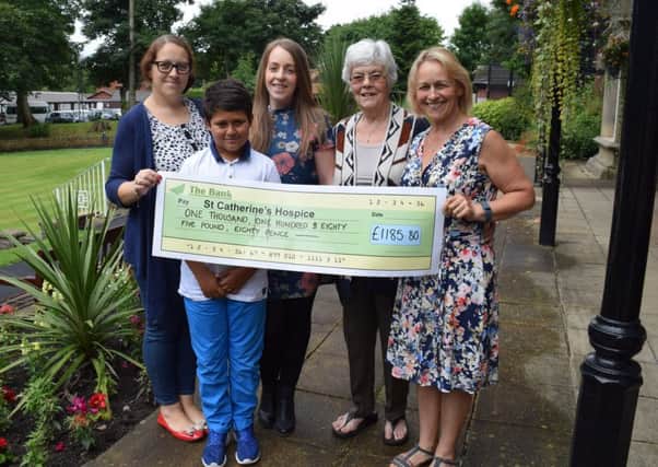 Vicky Mills, her son and event helper Zak Chap, Jenni Mills, Cath Knox and Barbara White held a Ladies barbecue in aid of St CatherineÂ’s Hospice
