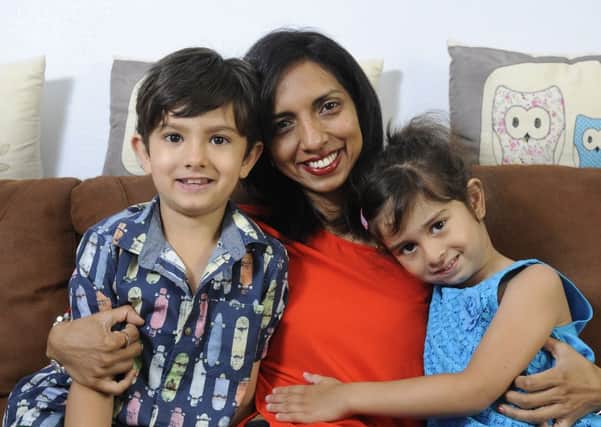 Seven-year-old Euan Hird is recovering following an escalator accident. He is pictured with sister Zara Hird, 4 and mum Nishala Hird.