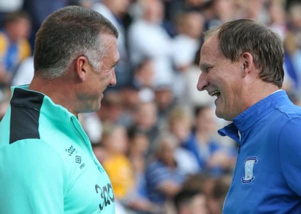 Simon Grayson and Nigel Pearson share a joke before PNE's clash with Derby