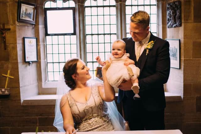 Dave Wall, wife Hannah and daughter Imogen on their wedding day in May 2015