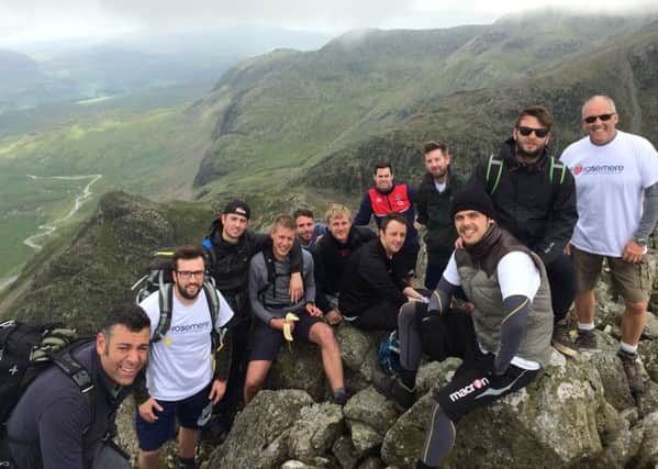 Friends Simon Bleasdale, brother Nick Bleasdale, Dean Ash, Eugene Marchuk, Joel Jackson, Tom Barnes, Lloyd Rigby and Chris Pigott, Adam Wall,  Rob Thompson and Geoff Thompson scale eight Lakeland Fells in memory of Dave Wall, 28.