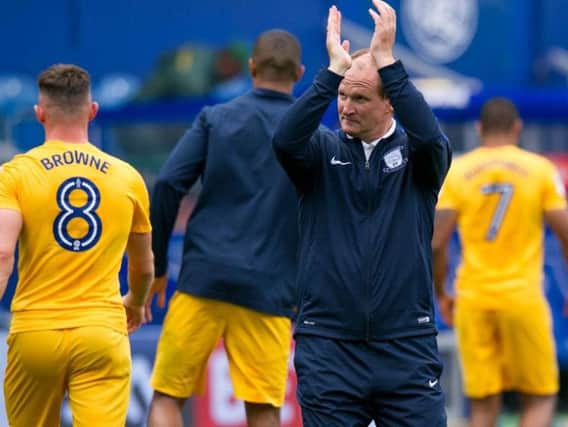 Simon Grayson salutes the Preston fans after his side's win at QPR.