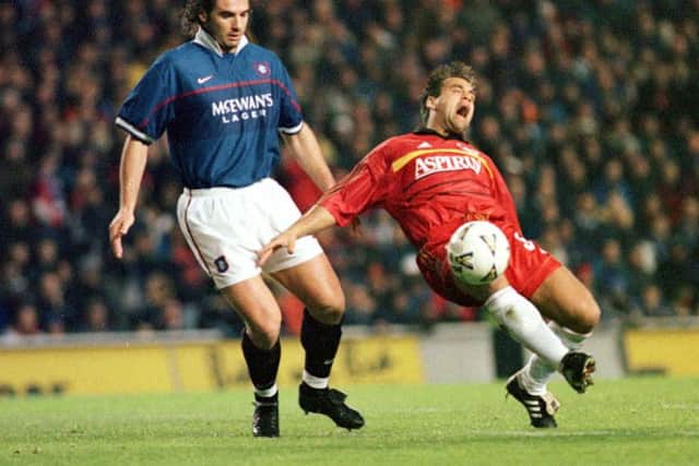 Lorenzo Amoruso challenges Bayer Leverkusen's Uls Kirsten at Ibrox in UEFA Cup  during his days at Rangers