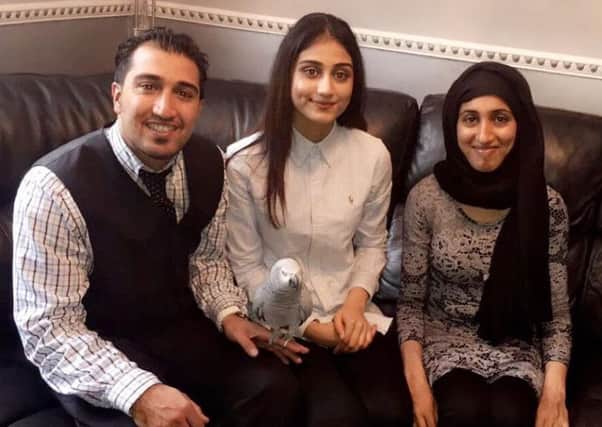 A Chorley family is thanking thousands of people who helped their campaign to find their lost parrot, Rosie in Chorley.Pictured: Brother Shoaib and sisters Fatima and Sabiha with their parrot Rosie.