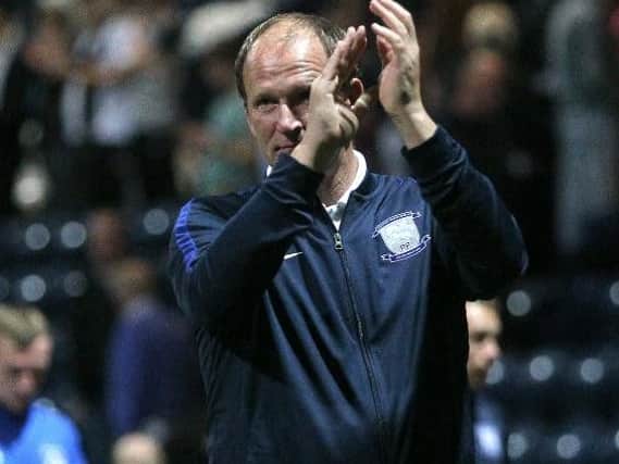 Simon Grayson salutes the fans at the final whistle.