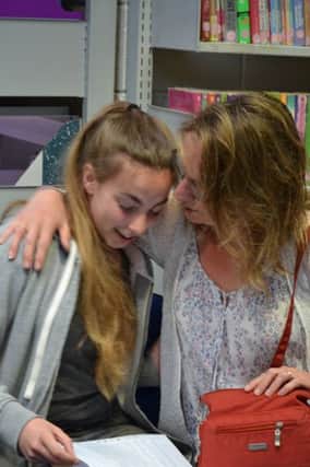 Melissa Bateman and her mum look over her results