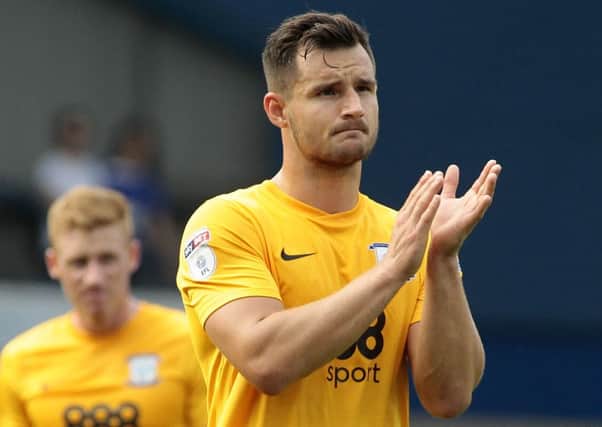 Preston North End's Bailey Wright applauds the travelling support after the defeat at Ipswich.