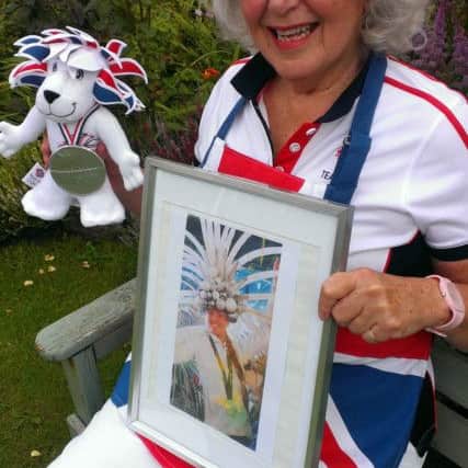 Proud Babs shows off a photo of Polly at the Rio Olympics closing ceremony.