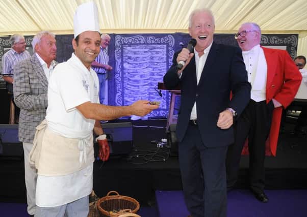Oyster and Guinness Festival at Guy's Thatched Hamlet in Bilsborrow.Celebrity guest Keith Chegwin officially opens the festival by eating the first osyer, presented by chef Nicola Madera, with Guy's owner Roy Wilkinson (left) and Master of Ceremonies Darrel Edwards.  PIC BY ROB LOCK2-9-2016