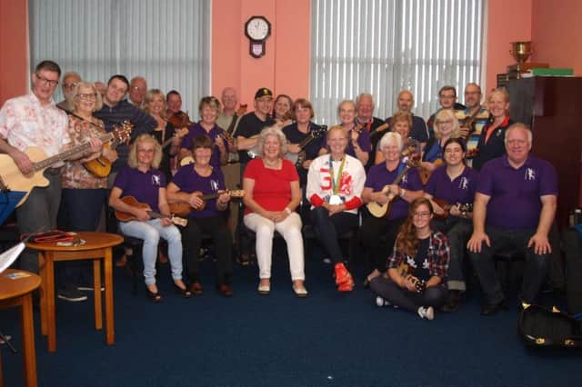 Olympic silver medal winning rower Polly Swann and her nan Barbara McInnis with members of Morecambe Ukulele Club.