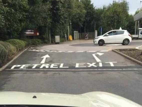 The road marking pointing towards the Sainsbury's "petrel" station. (Photo: Deborah Kelly).
