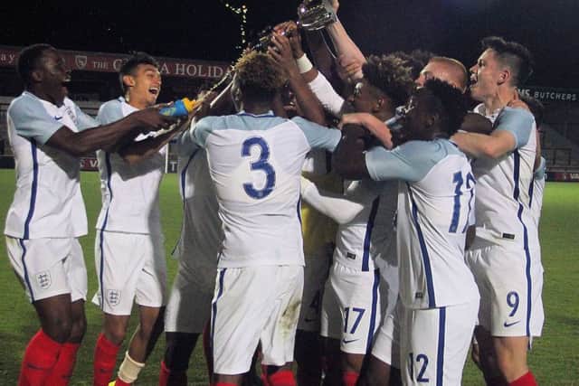 England's youngsters lift the trophy at the Globe Arena.