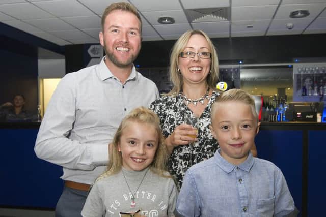 PNE community trust 30th anniversary - soccer school participants and twins Poppy and Brett Mcgovern with mum and dad
