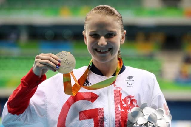 Great Britain's Stephanie Slater with her silver medal in the medal ceremony for the Women's 100m Butterfly S8 at the Olympics Aquatics Stadium