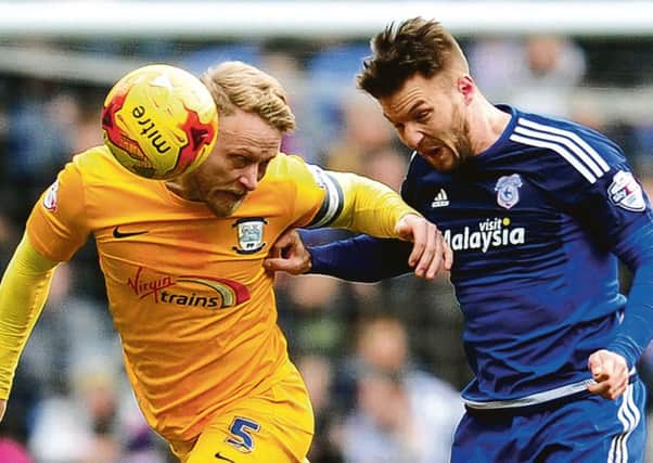 Tom Clarke and Anthony Pilkington battle for the ball during PNE's visit to Cardiff last season