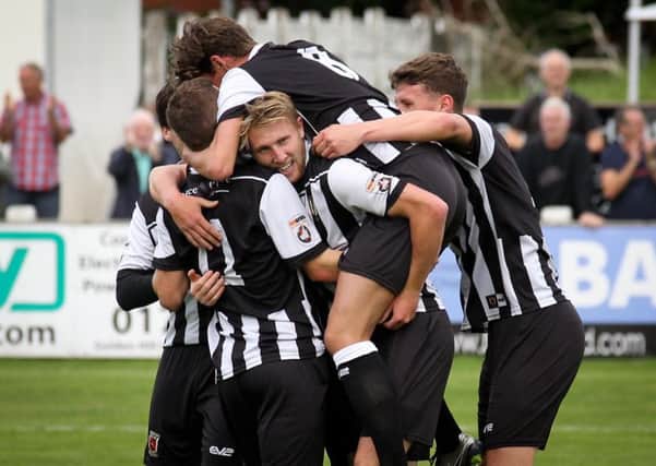 Chorley players celebrate opening the scoring against Brackley