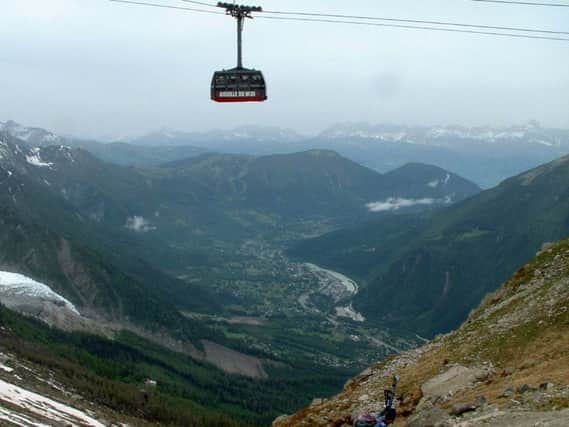 A cable car takes in the sights of the French Alps. See letter below			       Picture courtesy of Graham Archer