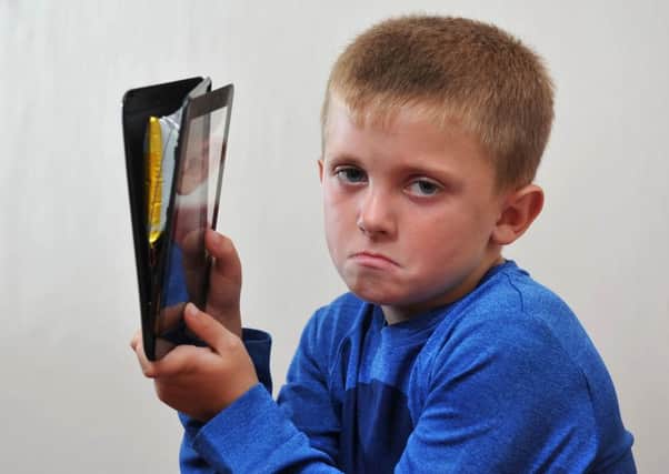 Photo Neil Cross
Seven-year-old Alfie Mitchell was playing a game on his tablet when the battery inside it exploded