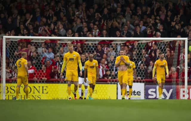 Preston North End players look  dejected as Brentford score 

three goals in the final six minutes to win 5-0