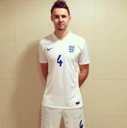 Michael Cartmell in his football shirt in December 2014 at St Georges Park