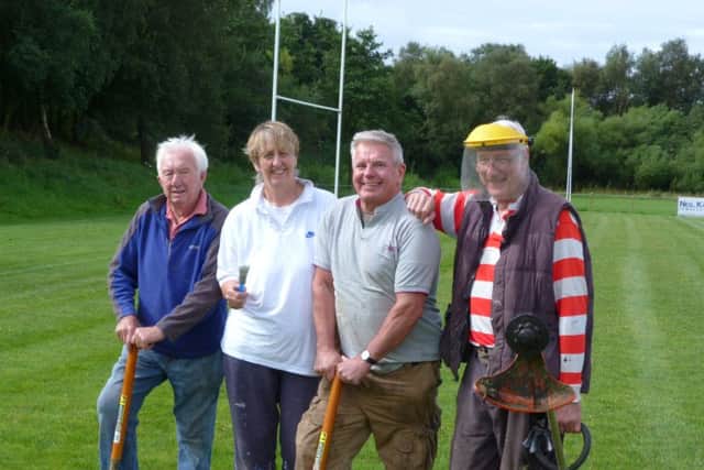 Norman Brown, Lorraine Hayes, John Malone and Ron Hayes work together to maintain the pitch for Chorley Panthers