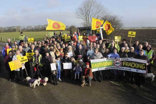 Residents and neighbours of Roseacre village gather to protest against fracking in the area. See letter
