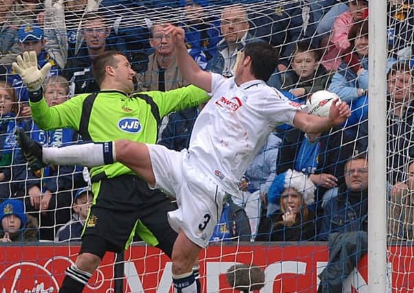 Brian O'Neil heads Preston's equaliser against Wigan in April 2005