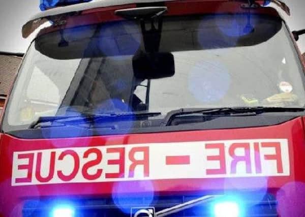 A child has been rescued by fire crews after becoming stuck on the roof of a Sunderland sports complex.