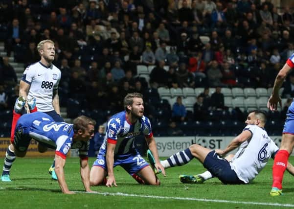 Bailey Wright and Tom Clarke join the Preston attack in  the second half against Wigan on Friday night