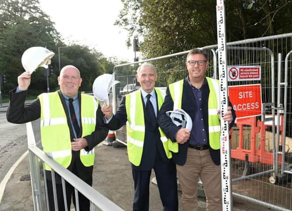 County Cllr John Fillis, Cllr Phil Smith and South Ribble Community Works Manager Howerd Booth at the top of Station Road, Bamber Bridge, where the new 'warm welcome to Bamber Bridge' sign will go.