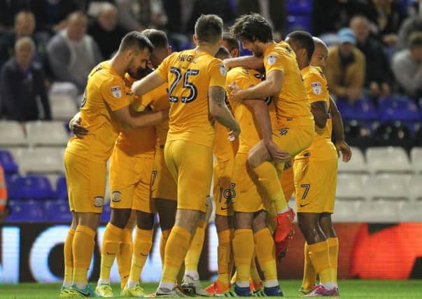 Daniel Johnson is mobbed by his PNE team-mates after scoring at Birmimgham