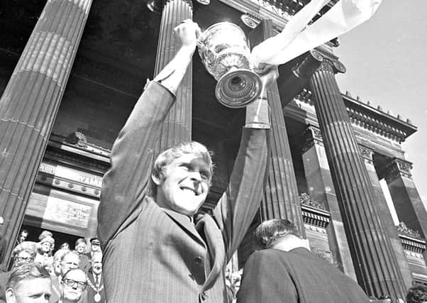 Graham Hawkins on the steps of the Harris Museum, lifting the Third Division trophy