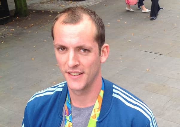 Scott Durant proudly wears his Olympic gold medal
