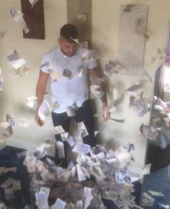 Craig Colman, 25, of Euxton, whose photos showing Â£12,000 in cash have gone viral